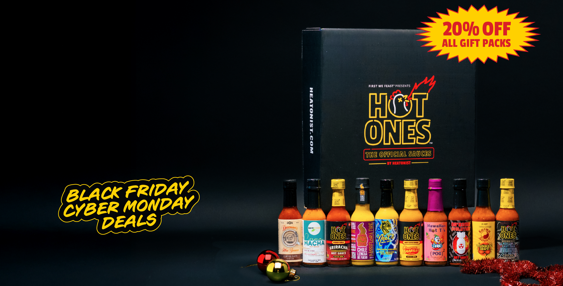 Hot Ones hot sauce bottles with a promotional sign for Black Friday and Cyber Monday deals.
