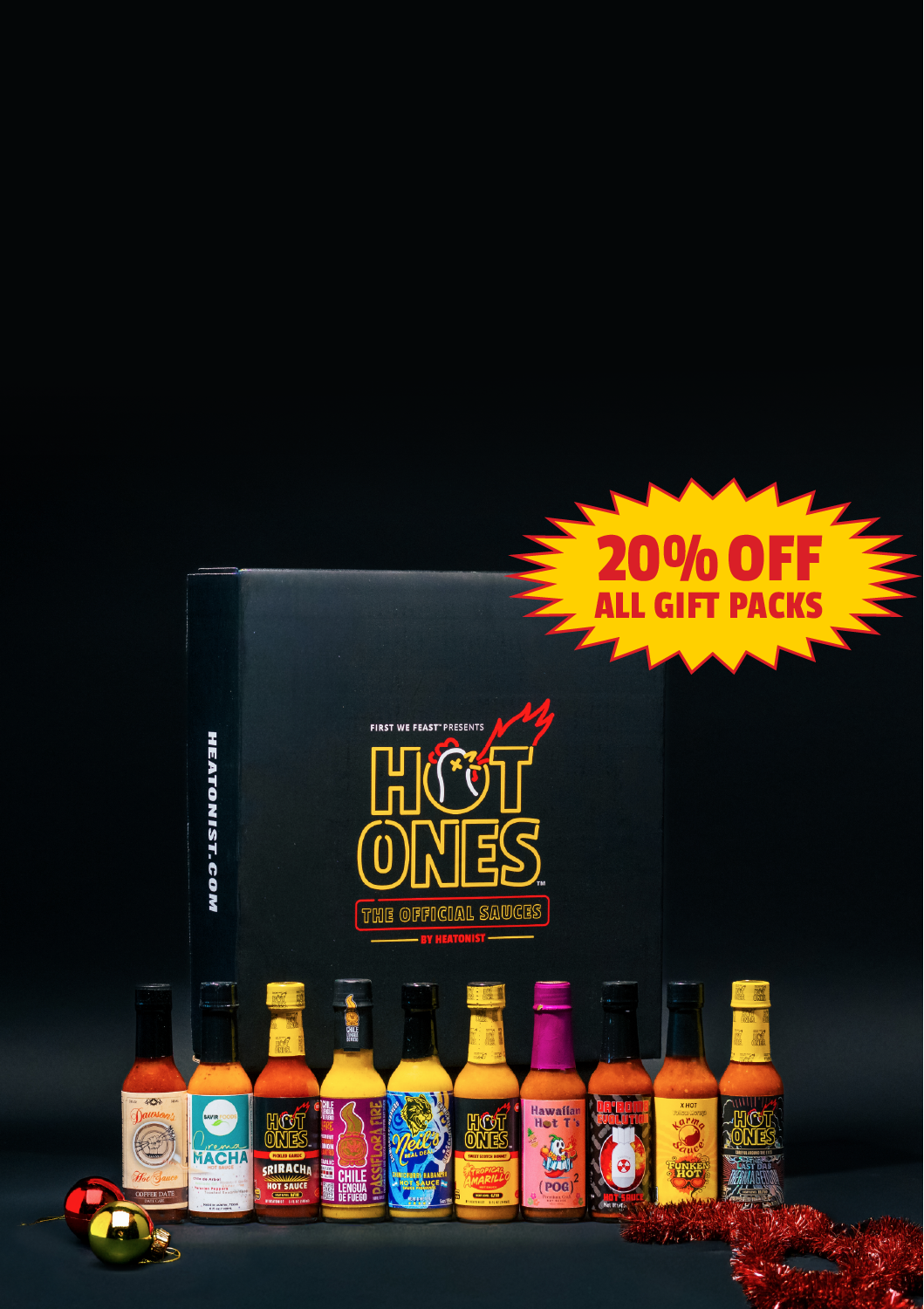Hot Ones hot sauce gift set with promotional text on a dark background